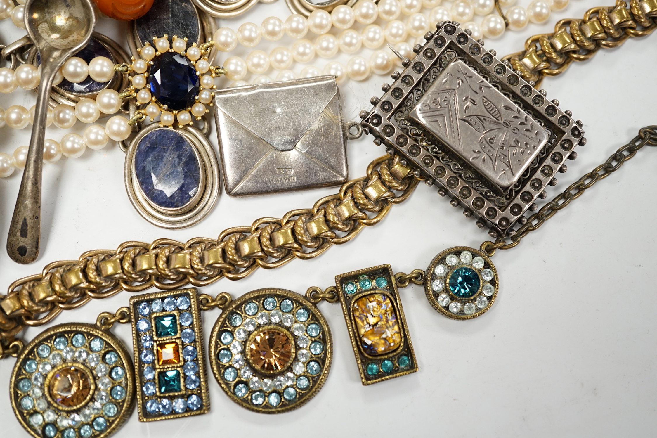 A small group of assorted costume jewellery, wrist and pocket watches and a silver envelope stamp case.
